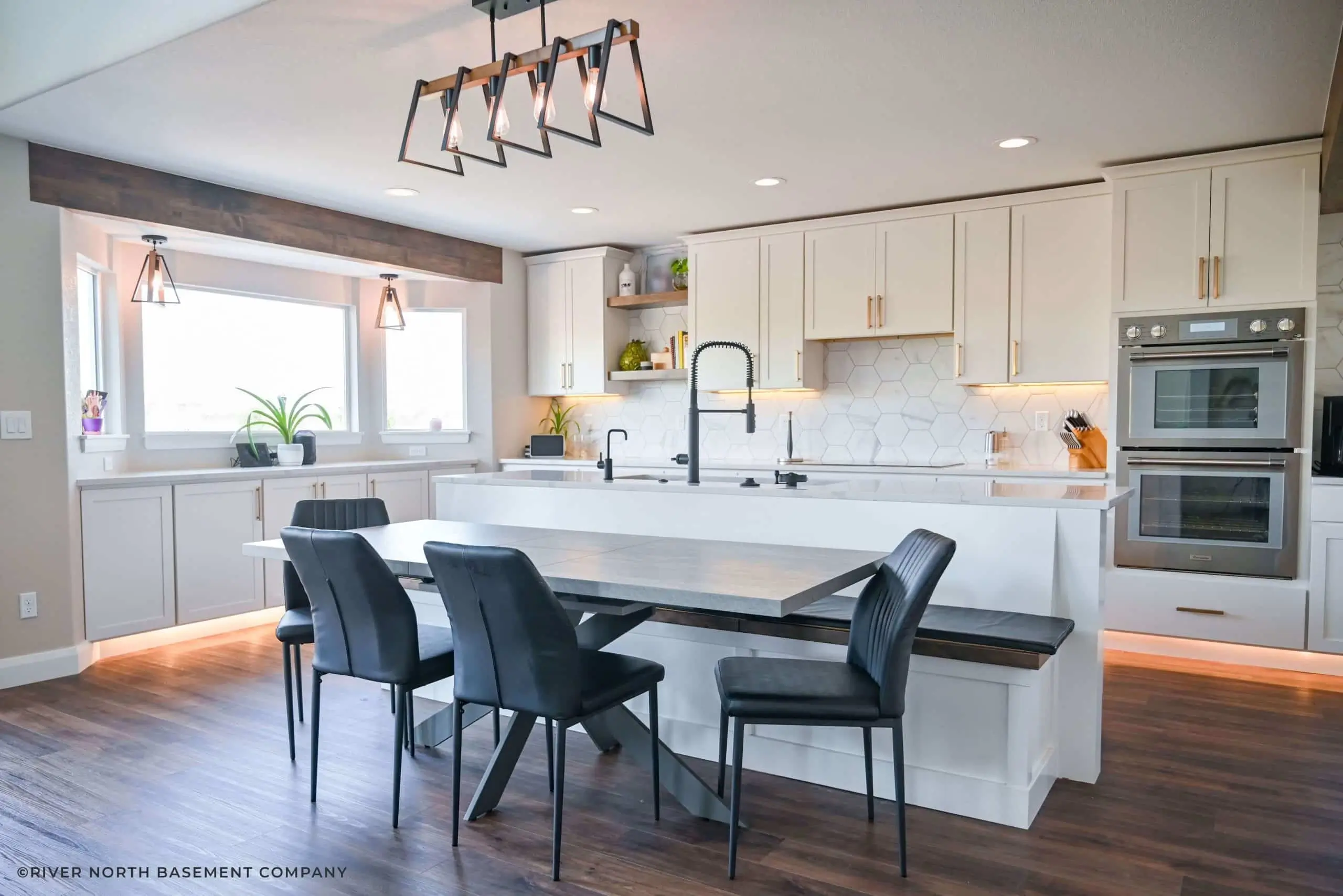 Modern finished basement remodel with open living space showing the results of a well-planned basement renovation.